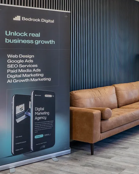 Bedrock Digital banner beside the lounge sofa