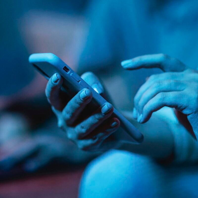 woman-using-her-smartphone-while-home woman-using-her-smartphone-while-home