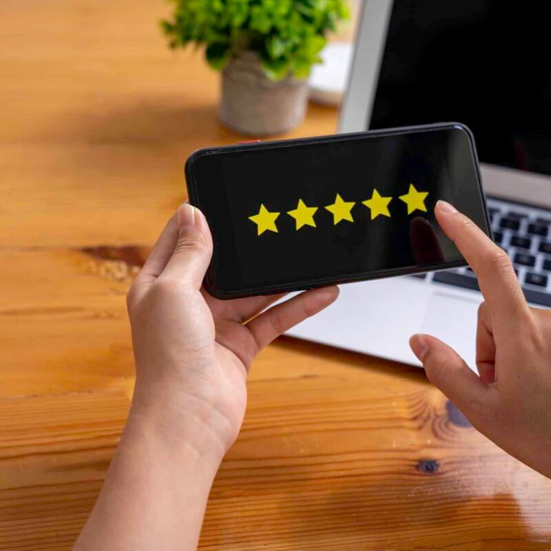 business woman using mobile phone Rate your satisfaction after shopping online. through a smartphone application