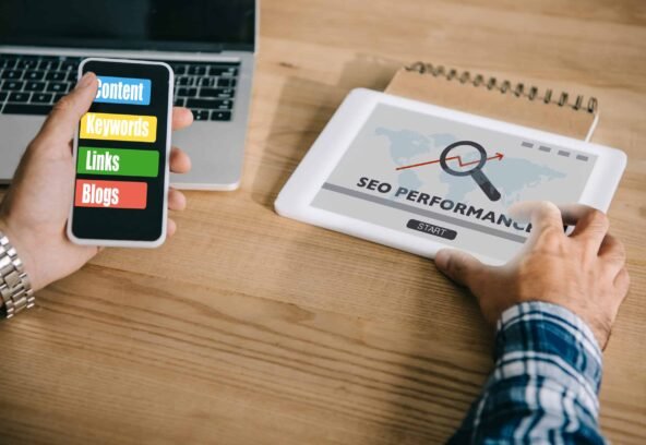 cropped shot of professional developer using different gadgets with SEO performance