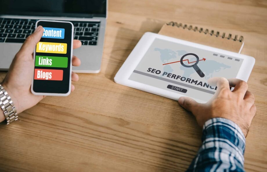 cropped shot of professional developer using different gadgets with SEO performance