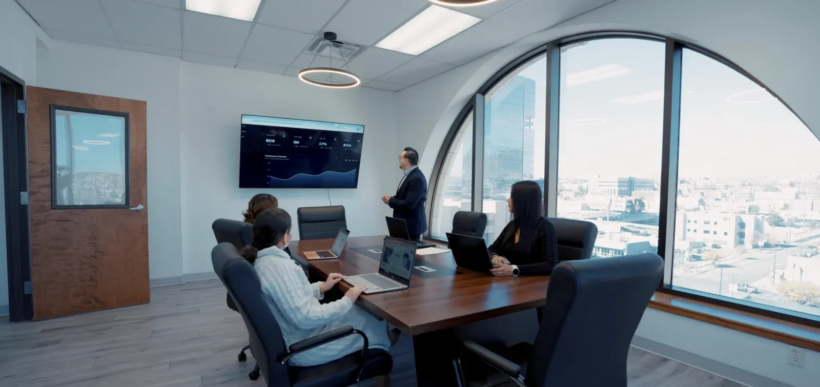 Marketing by industry: Bedrock Digital team reviewing client performance in the El Paso boardroom