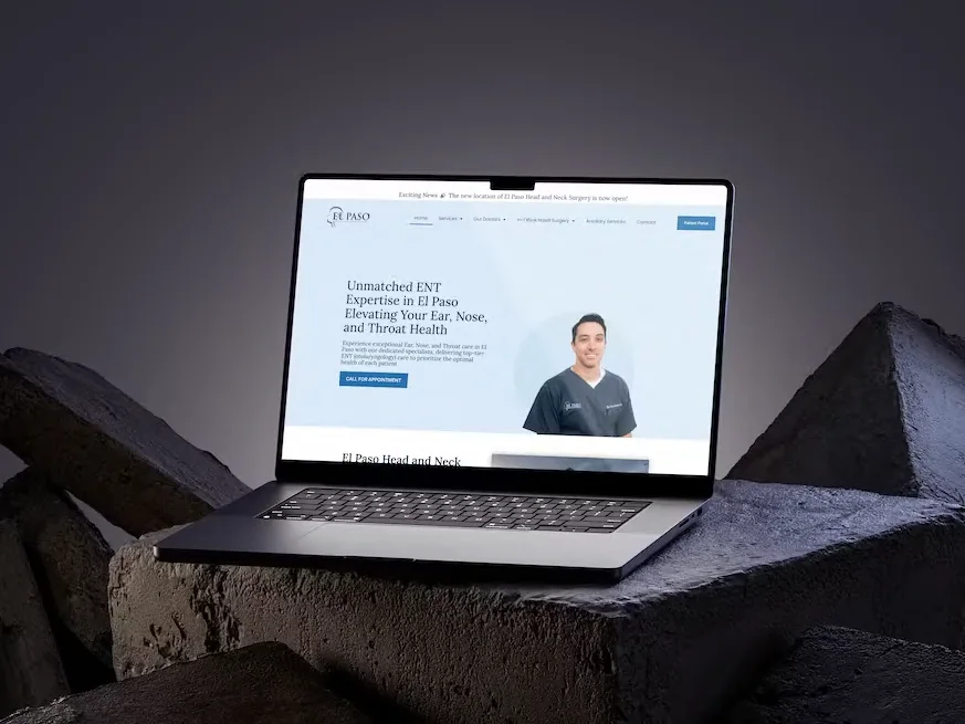 The El Paso Head and Neck Surgery website built by Bedrock Digital, on a laptop resting on dark stone